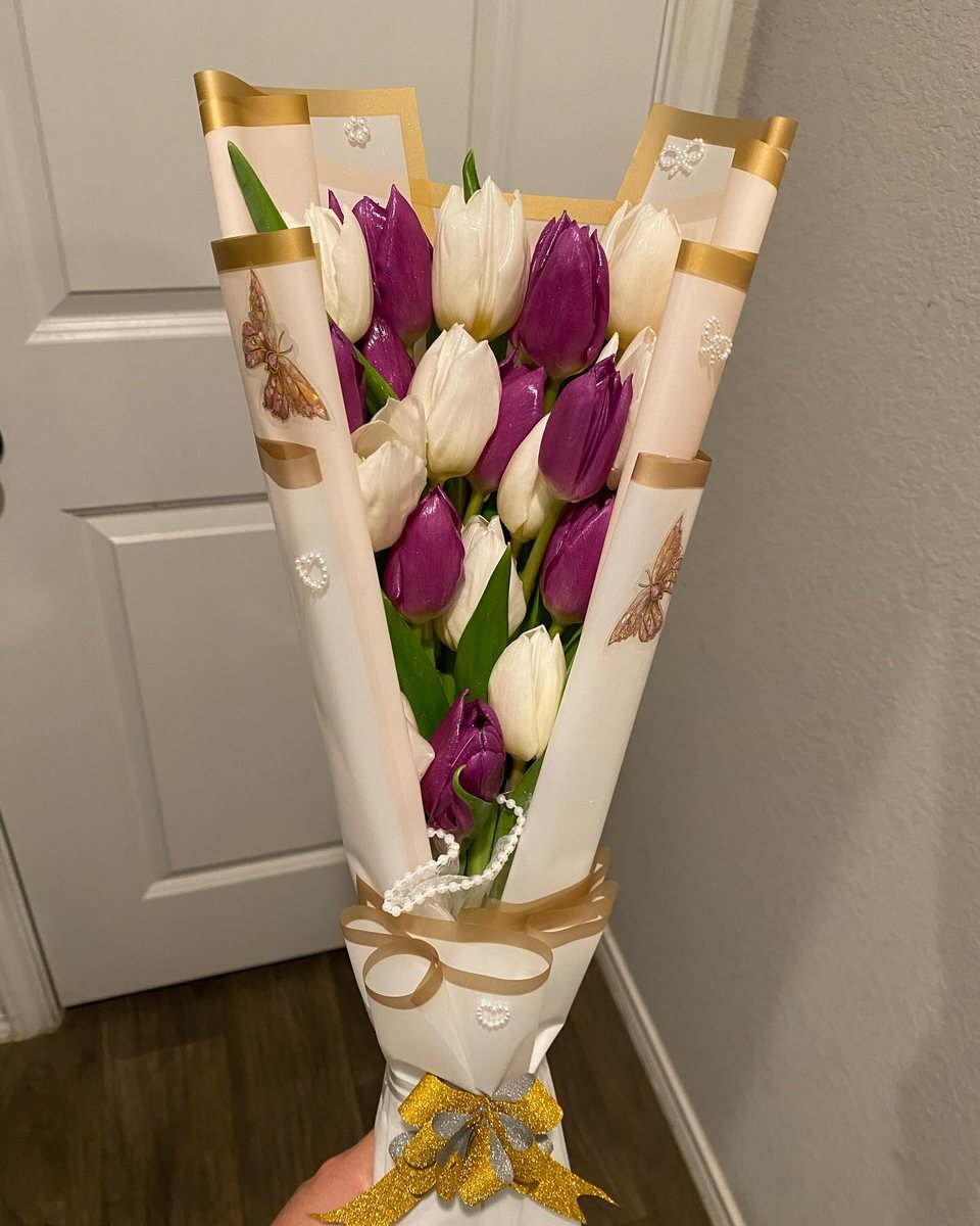 Purple tulips in a gold-edged pleated cone